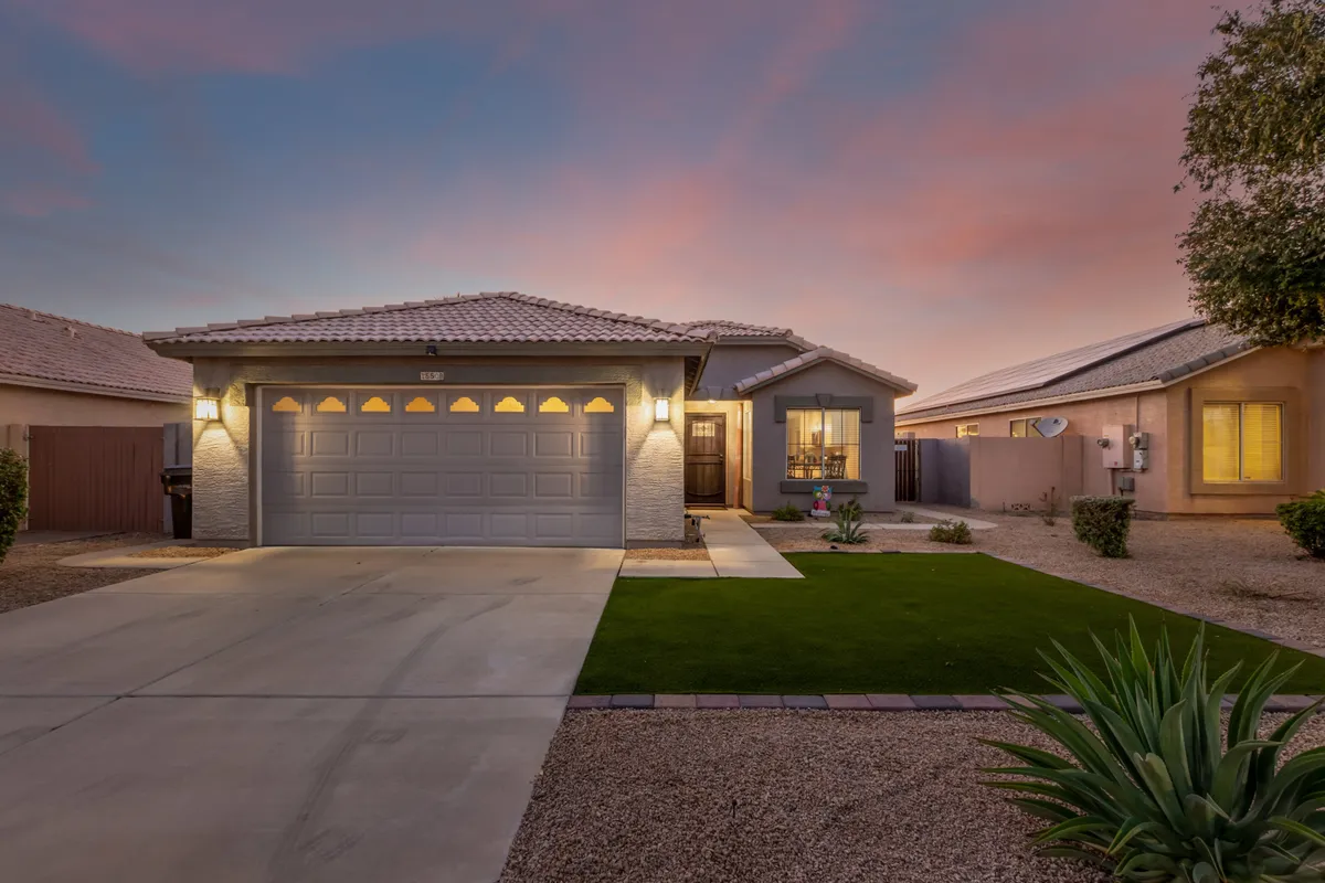 An exterior shot capturing the welcoming front entrance, landscaped lawn, and a pathway leading to the door. The view suggests easy access to and from the home, with a sense of community and curb appeal—ideal for families heading out to explore nearby parks or return from local adventures.